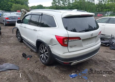 2020 Honda Pilot Awd Touring 8 Passenger z USA, uszkodzony, nr VIN 5FNYF6H91LB053626